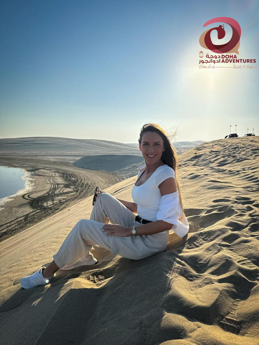 a lady sitting in dunes